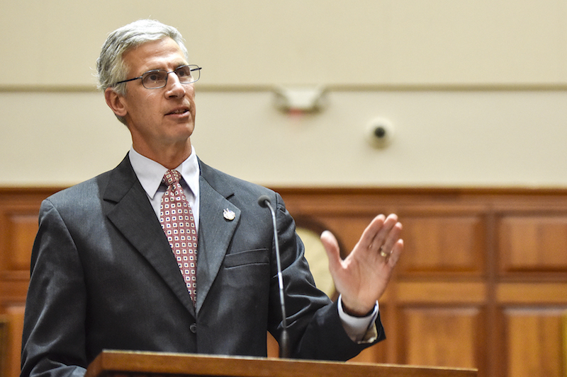 Jim Noble speaks at a courtroom podium