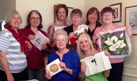Our Needlework Group shows off some of their creations. 
