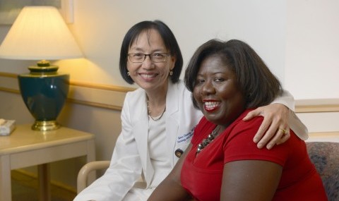 Advanced Practice Nurse Mona Cheung (left) with patient Twala Freeman.&