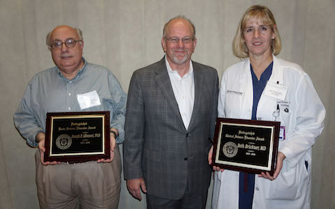The two recipients of 2016 Distinguished Educator Awards – Dr. Joseph Albanesi (left) and Dr. Beth Brickner – are joined by Dr. J. Gregory Fitz, Executive Vice President for Academic Affairs and Provost, and Dean of UT Southwestern Medical School.