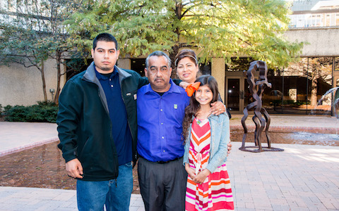 Roman Castilleja (left) meets the family of Ethan Trinidad, whose donated cornea improved his eyesight: Juan and Yolanda Flores, and their granddaughter, Jaeda Trinidad.