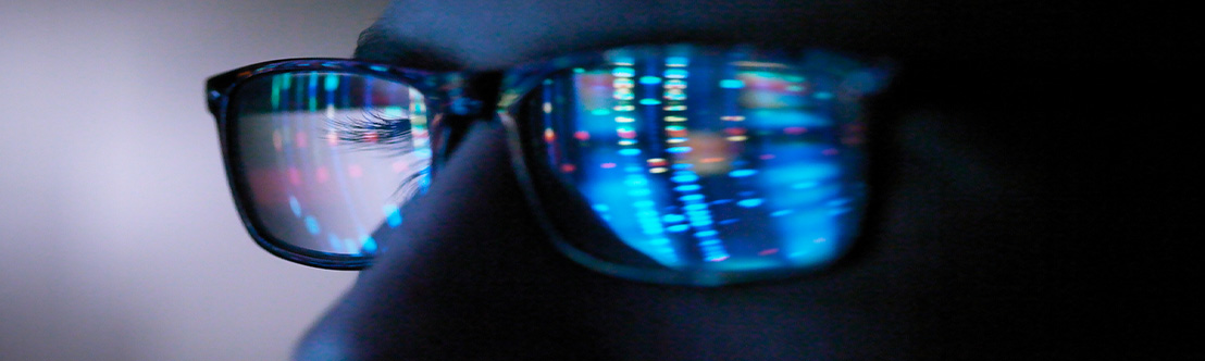 Close up of a person wearing dark sunglasses.