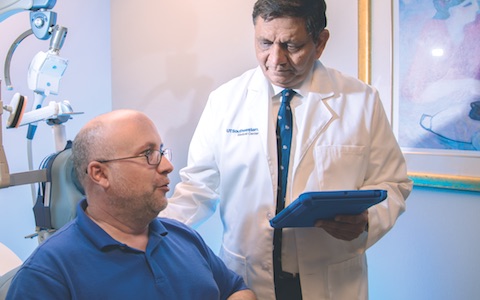 Dr. Madhukar Trivedi (right) confers with one of the patients who took part in a recent study that identified biomarkers for hypersomnia