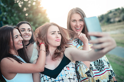 Decorative photo of teenagers taking selfies