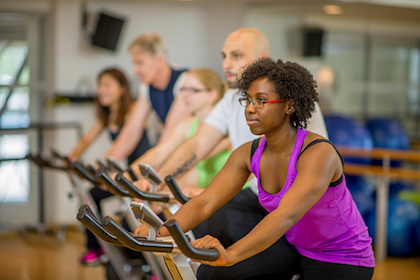 A diverse group of peope in spin class