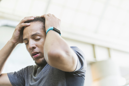 Man holding his head in pain