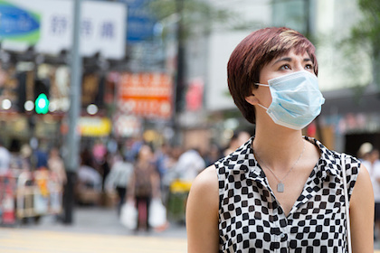 Woman wearing surgical mask in public