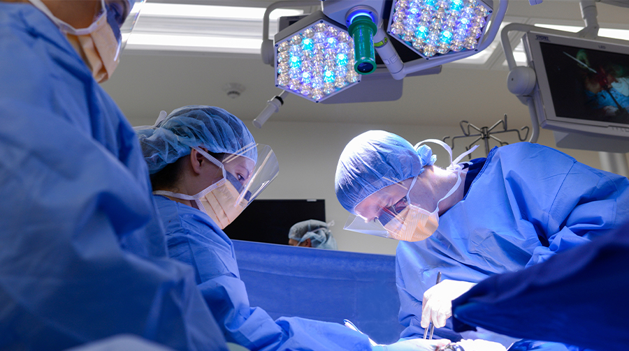 Three surgeons work in the operating room