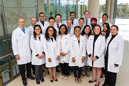 Group of people in white lab coats