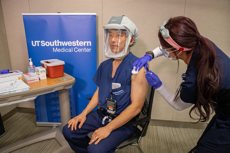 Jun Sasaki, M.D., receiving the vaccine