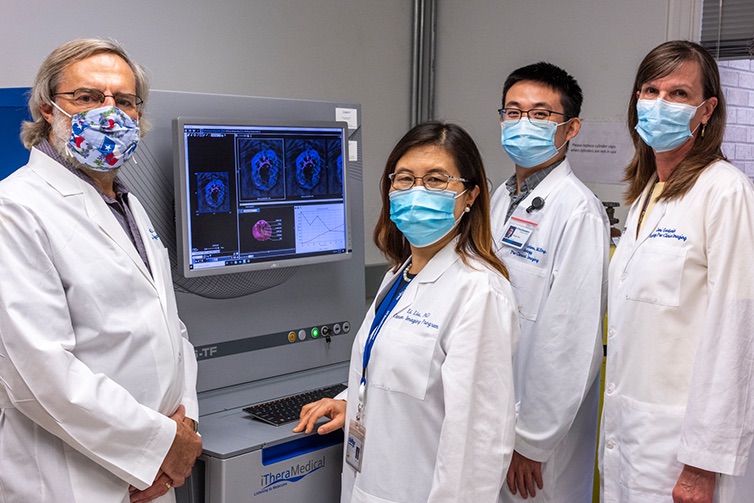 Drs. Ralph Mason, Li Liu, and Yihang Guo, and researcher Jeni Gerberich
