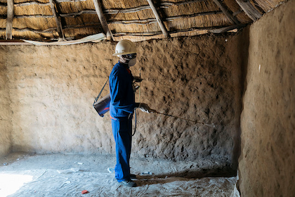 A man spraying a wall