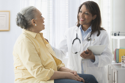 A woman talks with a female doctor