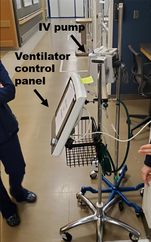 Ventilator control panel and IV pump located outside patient room