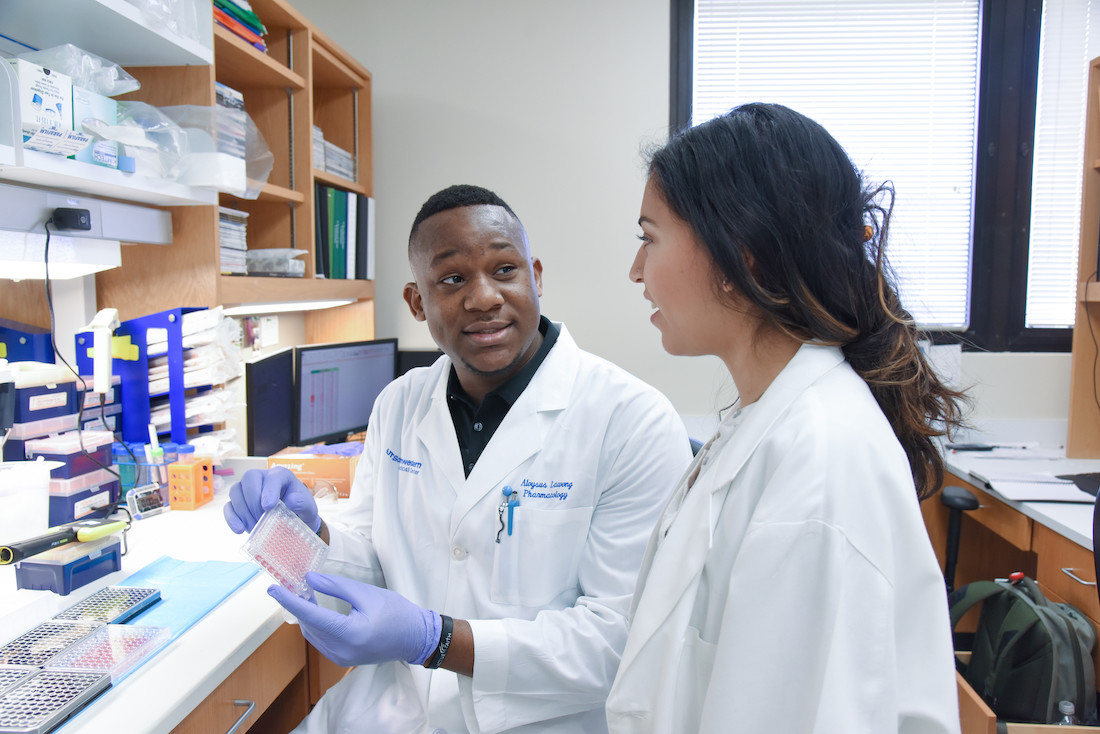 A man and woman in white lab coats photo