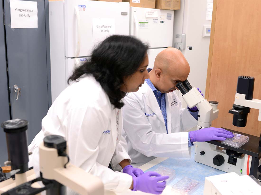 Photo of Lavanya Vishvanath, Senior Research Associate and Rana Gupta, Ph.D. in the research lab.