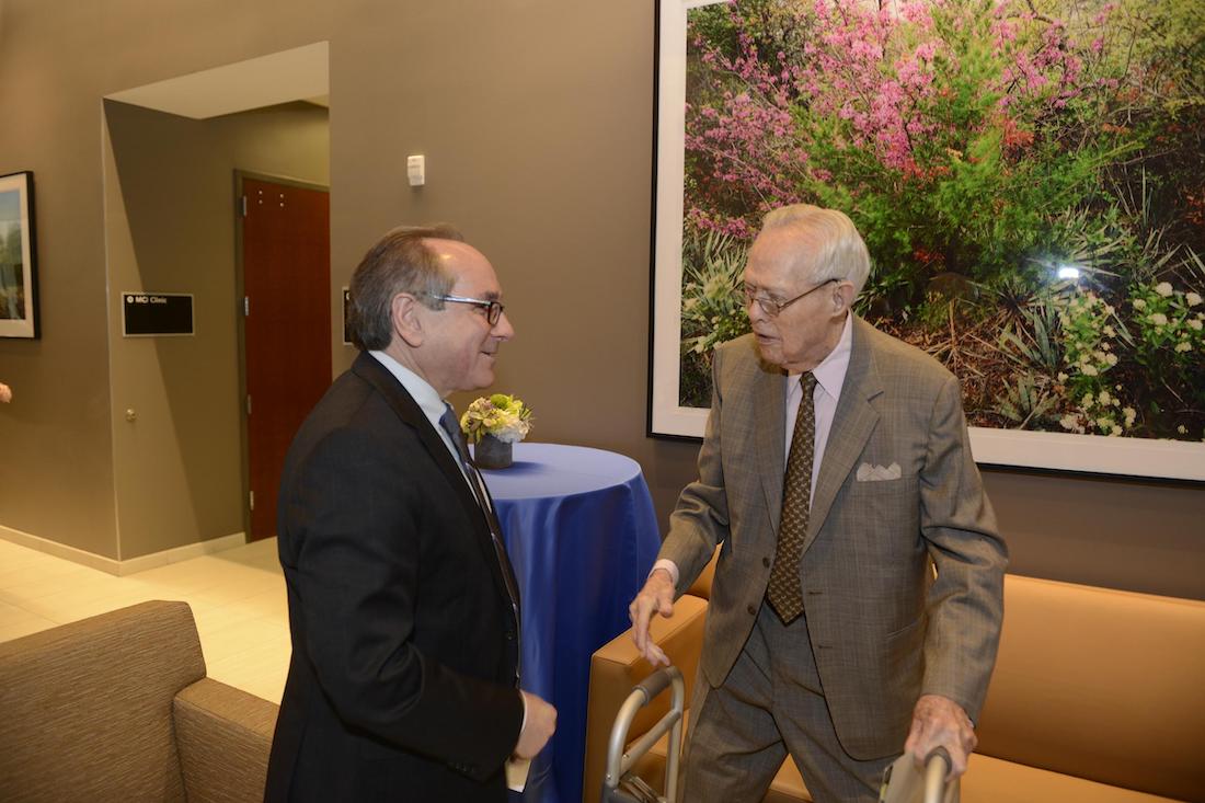 Photo of Dr. Daniel K. Podolsky, President of UT Southwestern, left, visits with W.A. “Tex” Moncrief Jr. at the opening in 2015 of the Monty and Tex Moncrief Medical Center at Fort Worth 