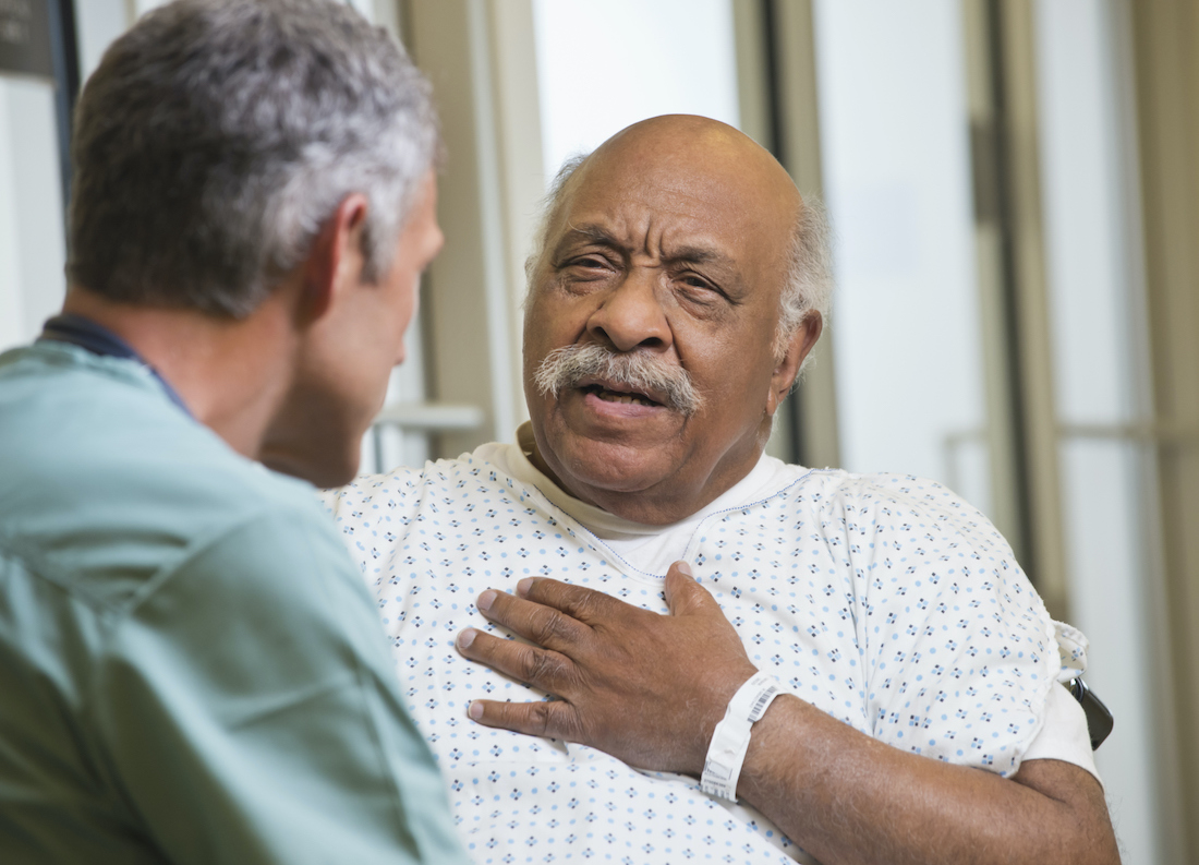 Doctor talking to patient in hospital