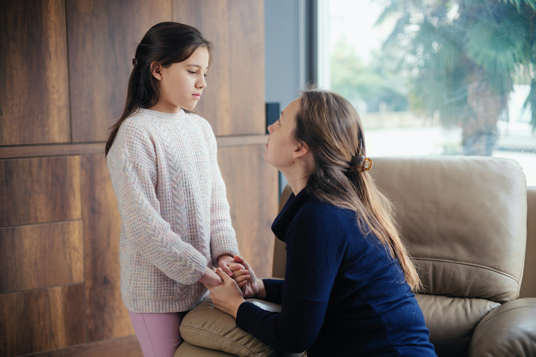 Mother consoling her daughter