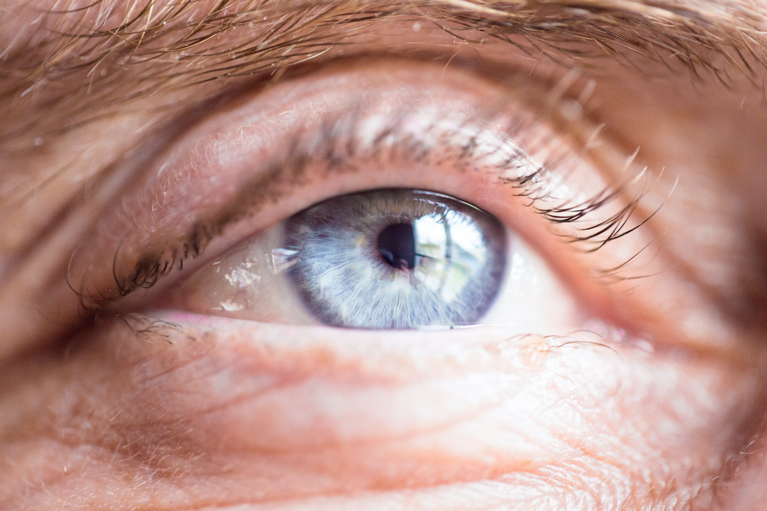 Blue eye close up of an old man