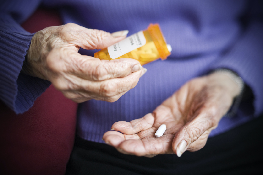 Senior woman taking prescription