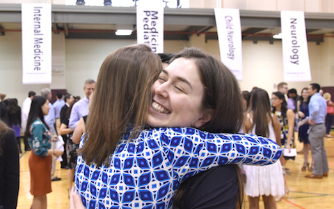 students hugging