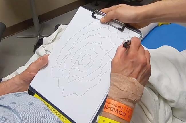 A hand drawing spirals
