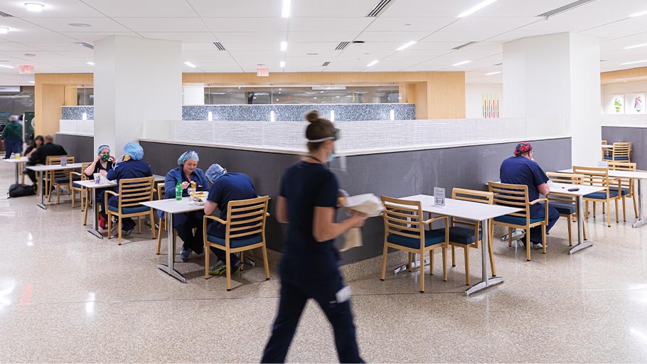 Employees eat at tables in the Haddock dining room
