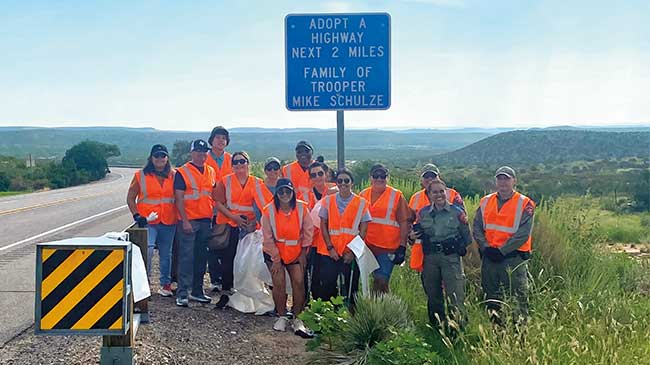 Michael Schulze’s family, friends, and co-workers gather to pick up litter along U.S. Highway 62/180 in Guadalupe Mountains National Park as part of the state of Texas’ Adopt-a-Highway program.