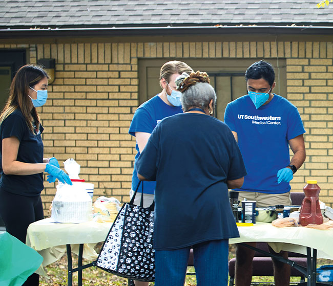 UT Southwestern medical students serve breakfast tacos to community residents in the Dolphin Heights neighborhood of Dallas.