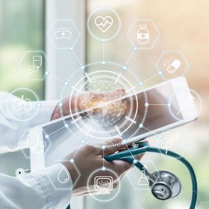 Hands holding a stethoscope and tablet beneath a translucent overlay of healthcare-related icons arranged in a circular pattern