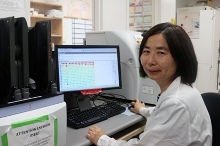 Screening scientist Shuguang Wei, Ph.D., reviews results on the Envision multi-mode reader.