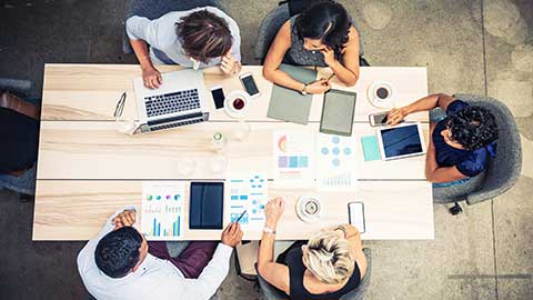 A group of people collaborating at a table