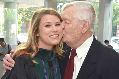 All in the family: Grandfather and granddaughter graduate 65 years apart