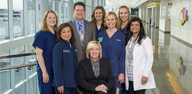 Eight UT Southwestern, who will join the ranks of the Dallas-Fort Worth Great 100 Nurses, are pictured standing together.