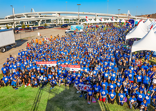 Aerial shot of large group in blue shirts outside during the 2017 Heart Walk