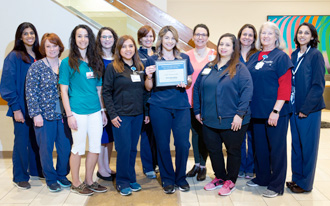 Cystic Fibrosis Team holding certificate