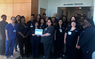 Digestive Team holding certificate