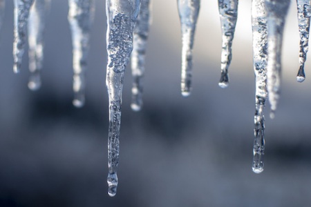 Icicles against a blue background