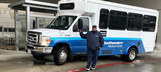 A UTSW shuttle driver at a shuttle stop