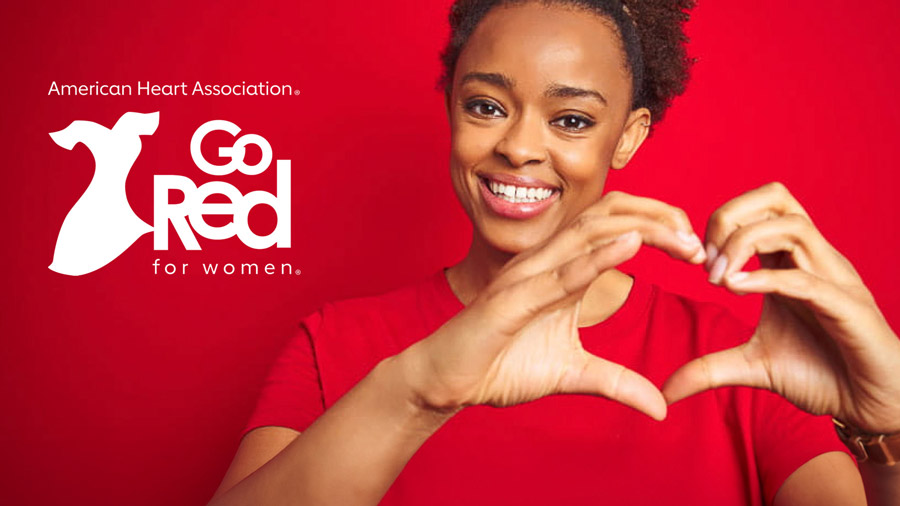 wear red with woman making heart sign